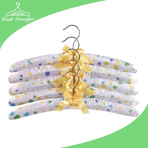 White wooden satin covered hangers with colored dots
