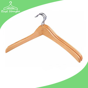 Wooden suits garment rail hanger at home or supermarket
