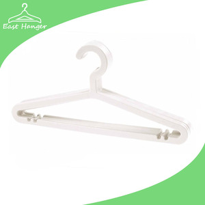 Slim white colored plastic clothes hangers